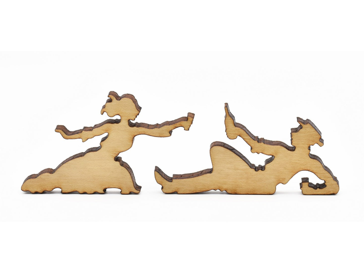 A closeup of pieces in the shape of two picnickers sharing a drink.