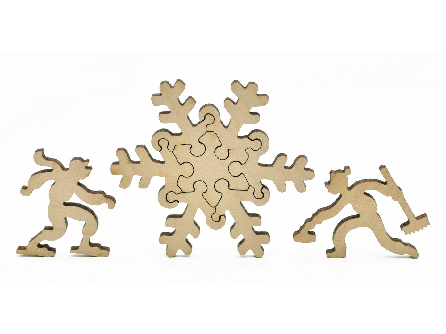 A closeup of pieces in the shape of a snowflake and people skating.