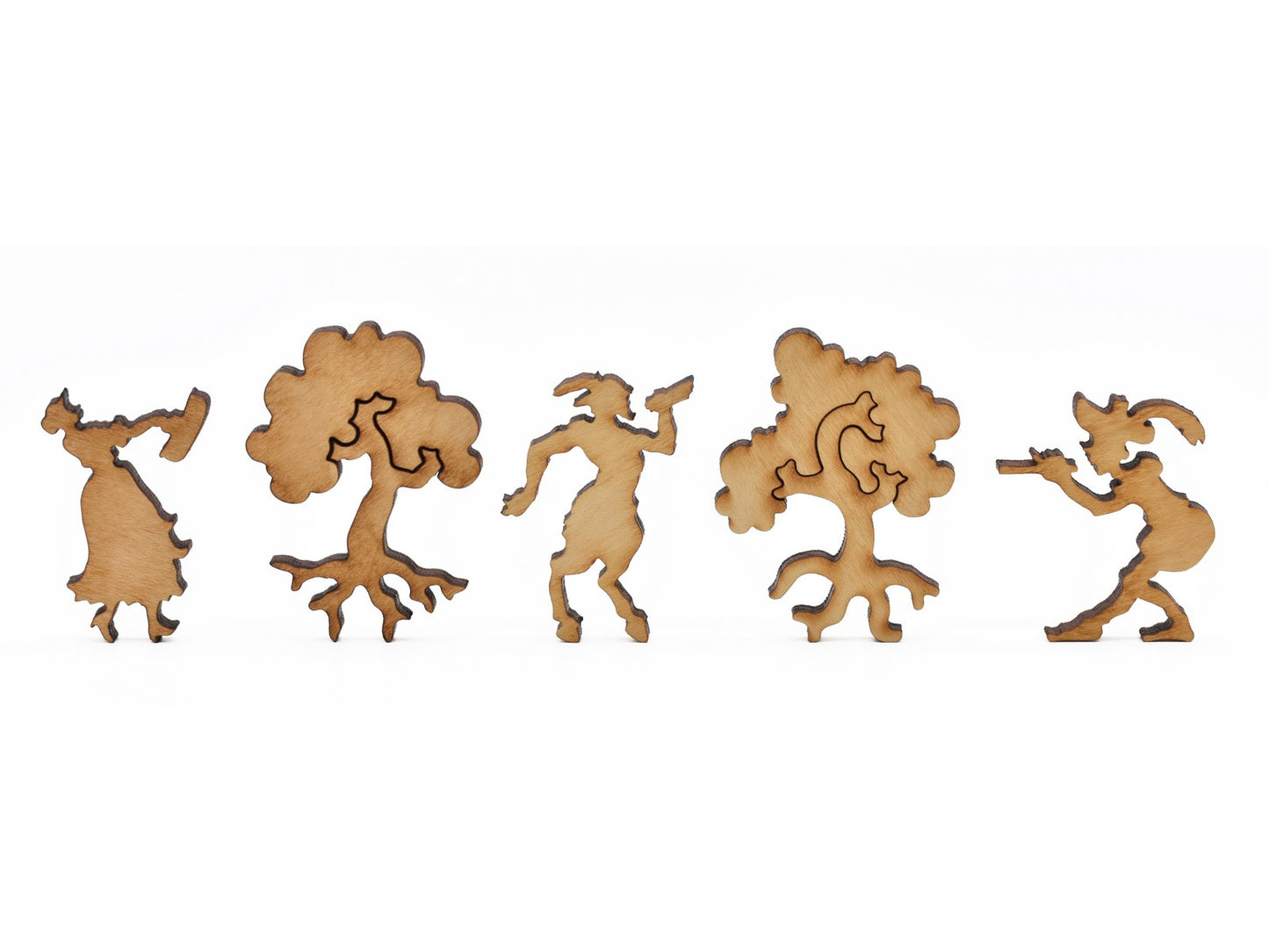 A closeup of pieces in the shape of figures in the forest.