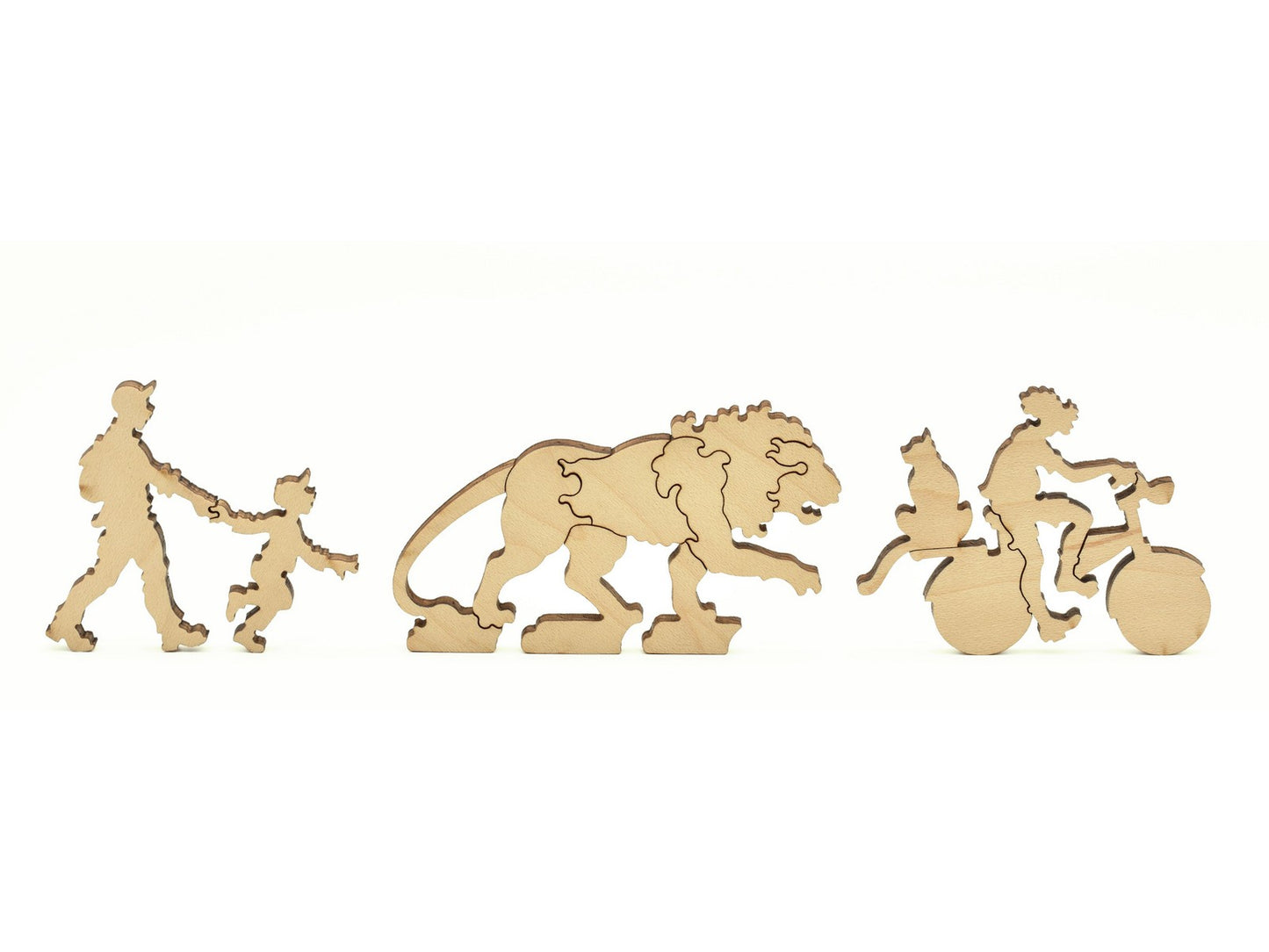 A closeup of pieces in the shape of a person with a child, a lion statue, and a person riding a bicycle.
