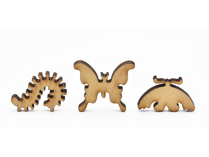 A closeup of pieces in the shape of insects.