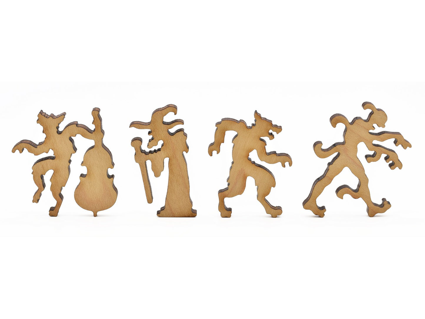 A closeup of pieces in the shape of a wizard, zombie, and werewolves.