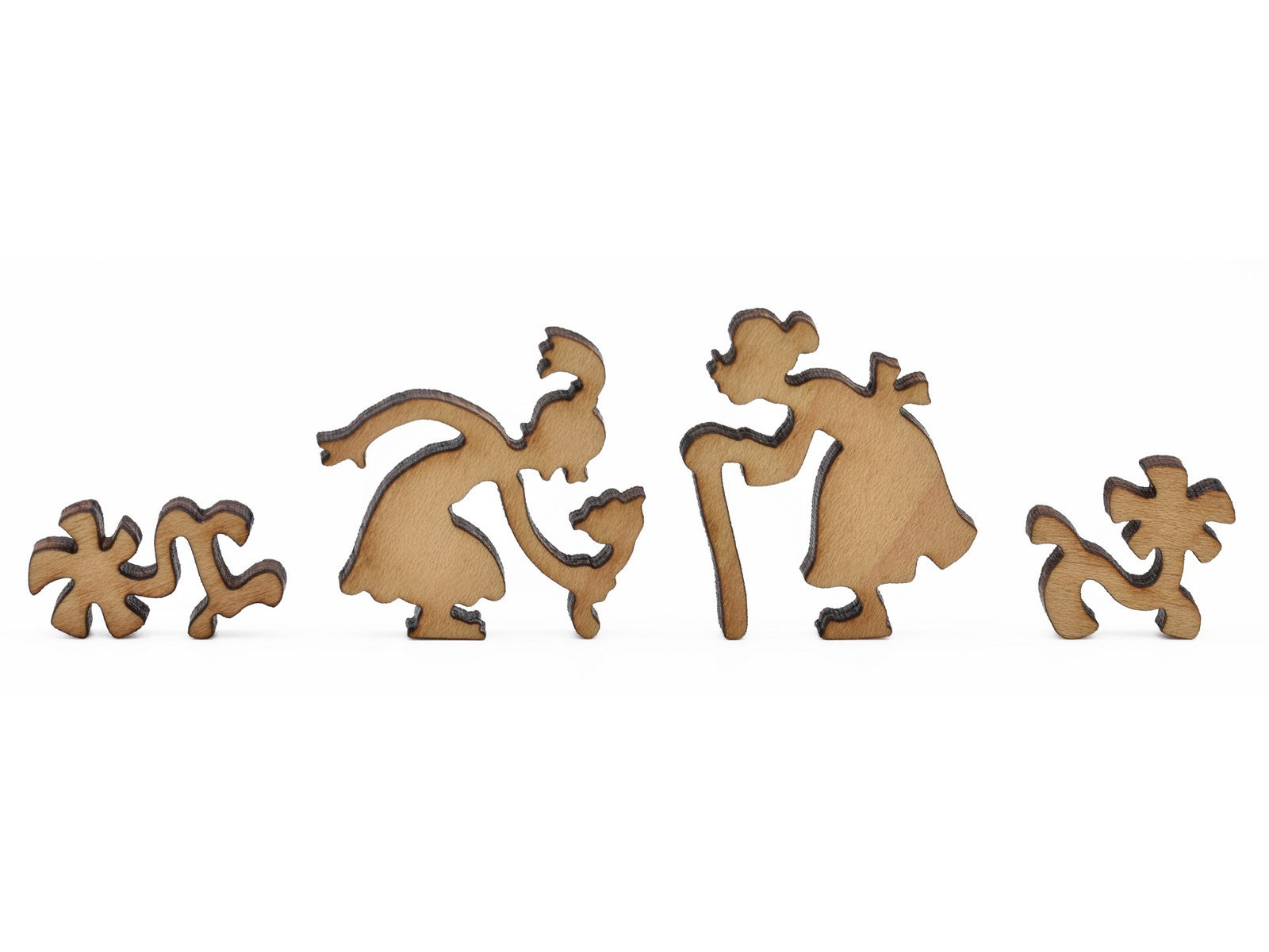 A closeup of pieces in the shape of a girl and an old woman.