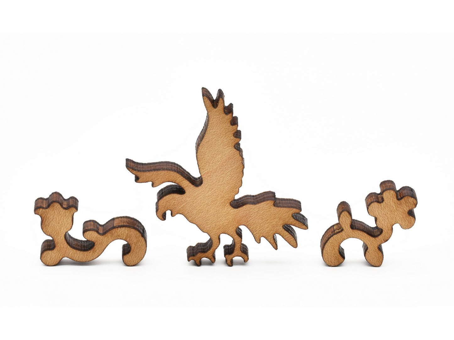 A closeup of pieces in the shape of a parrot and flowers.