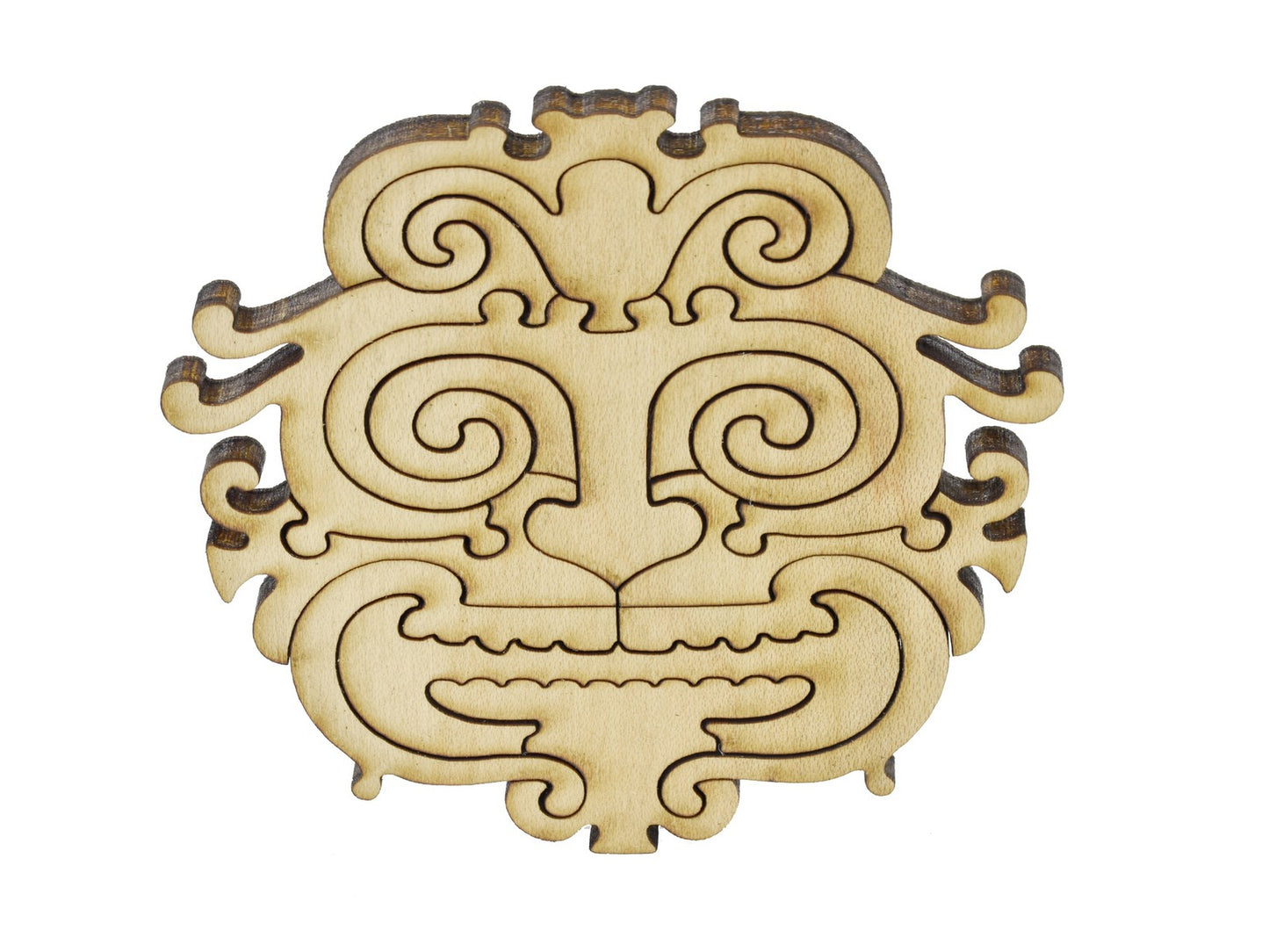 A closeup of pieces in the shape of a mask.