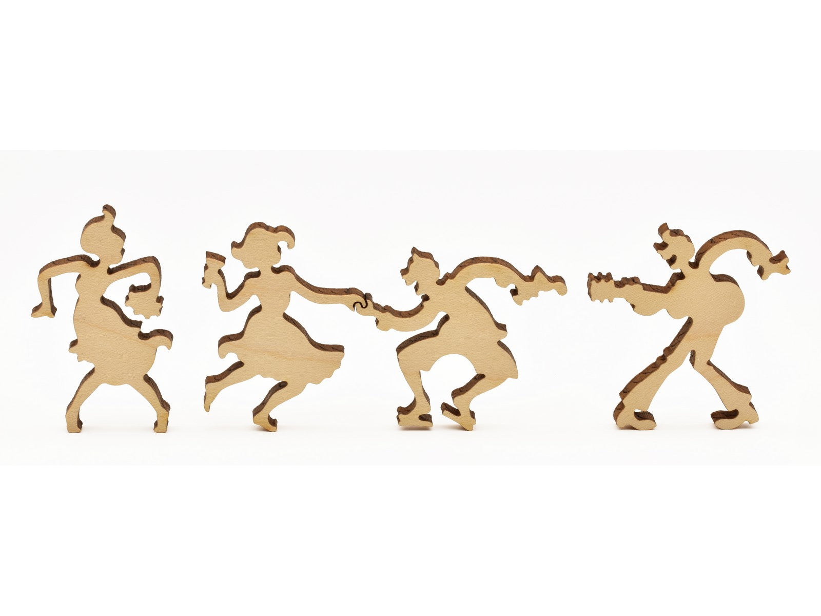 A closeup of pieces in the shape of people dancing.
