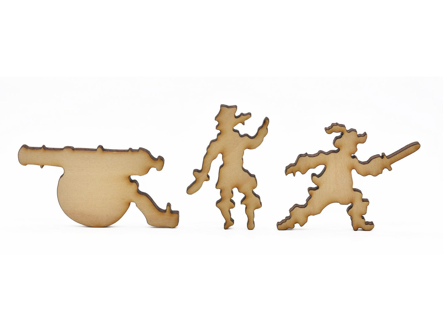 A closeup of pieces in the shape of pirates and a canon.