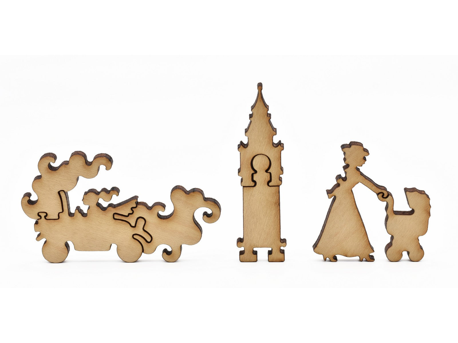 A closeup of pieces in the shape of a car, a clocktower, and a person pushing a stroller.