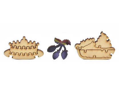A closeup of pieces showing cake, pie, and berries.