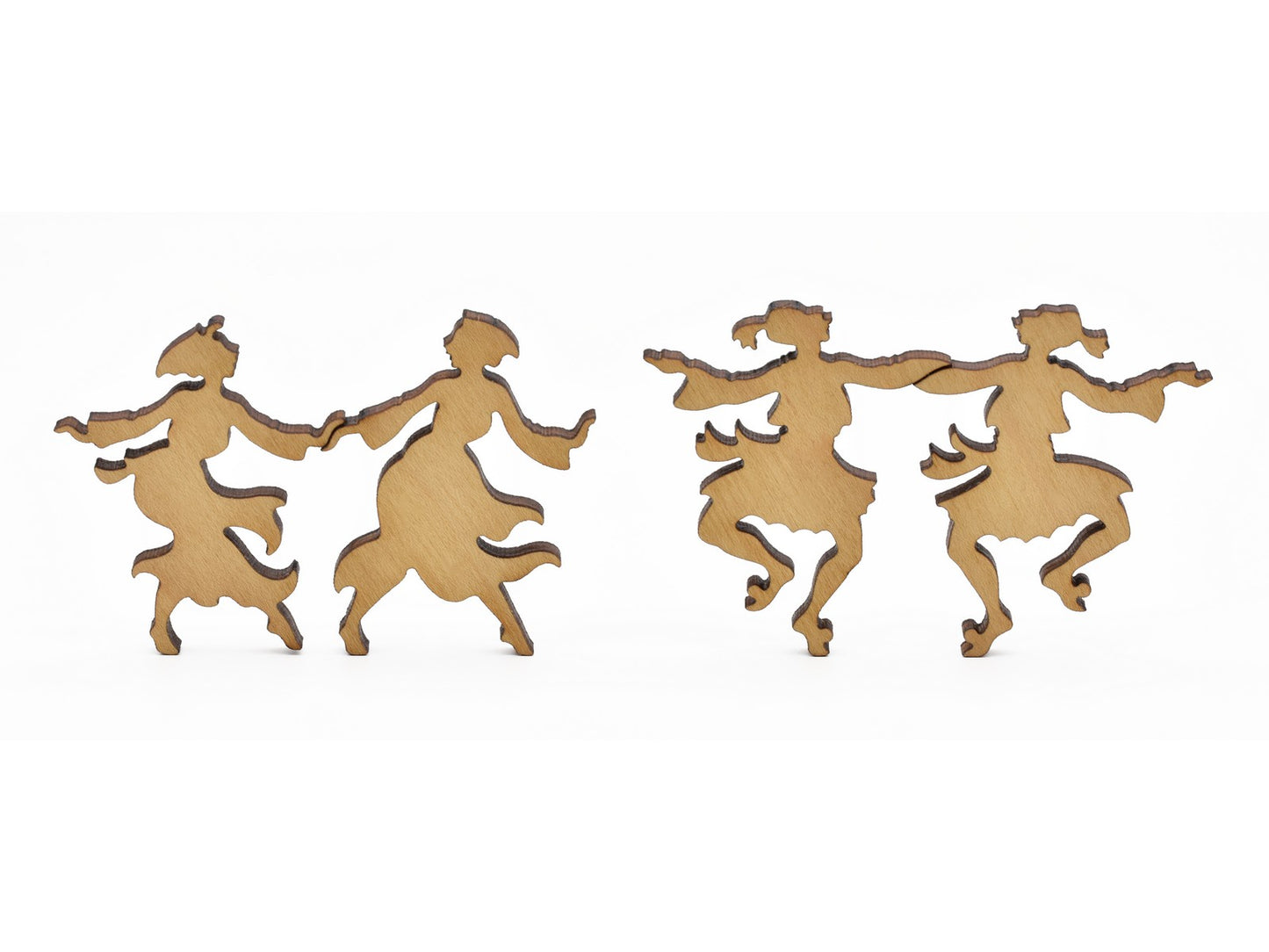 A closeup of pieces in the shape of people dancing.