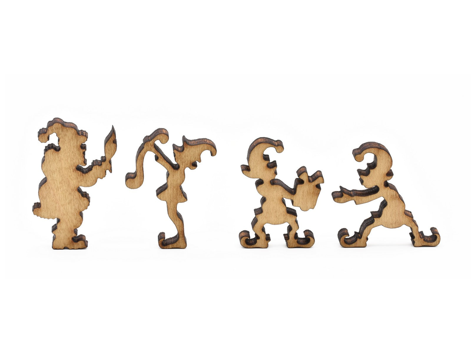 A closeup of pieces in the shape of santa and elves.