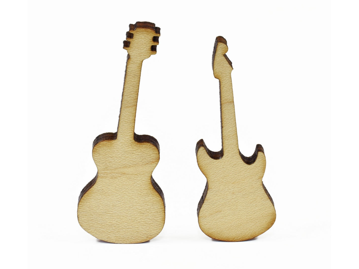 A closeup of pieces in the shape of guitars.
