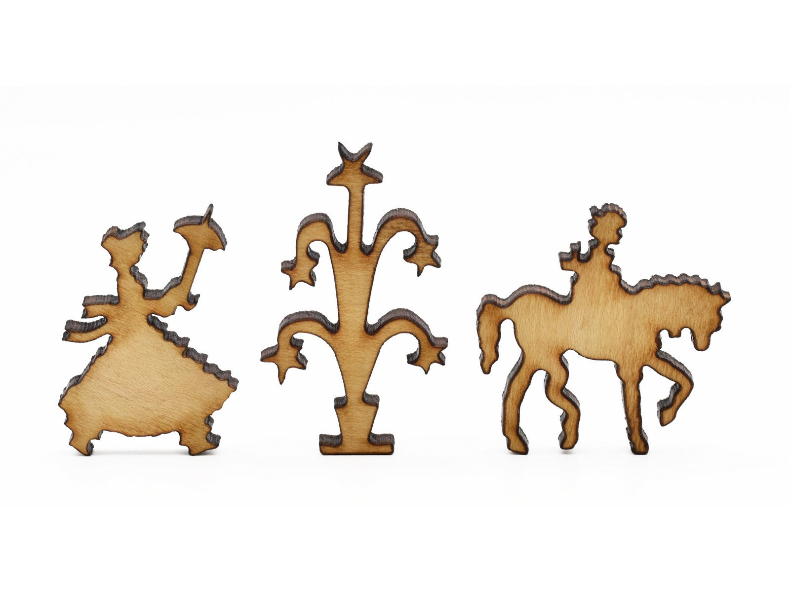 A closeup of pieces in the shape of a woman, a fountain, and a person riding a horse.