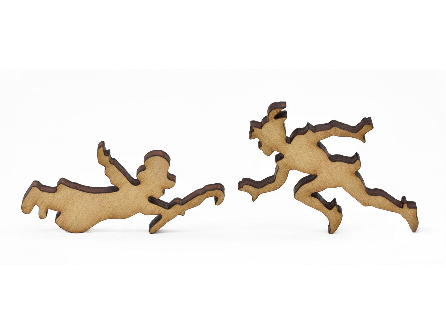 A closeup of pieces in the shape of peter pan and John Darling.