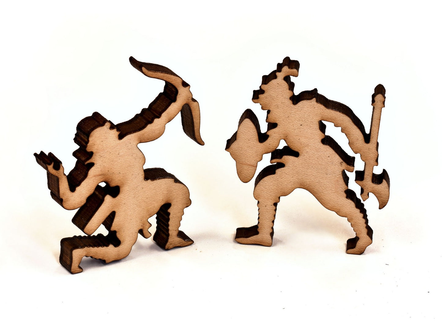A closeup of pieces in the shape of two warriors.