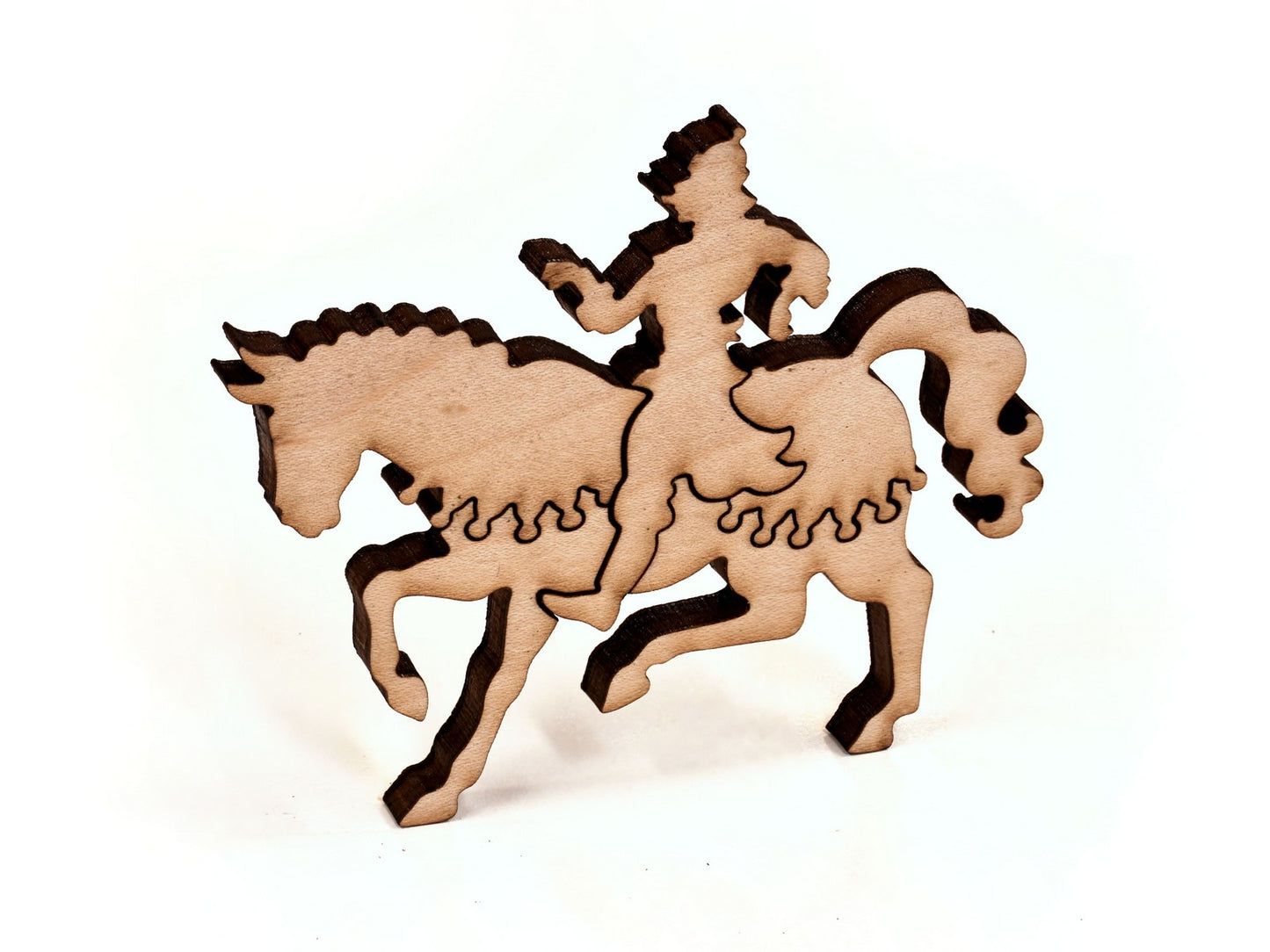 A closeup of pieces in the shape of warrior on a horse.