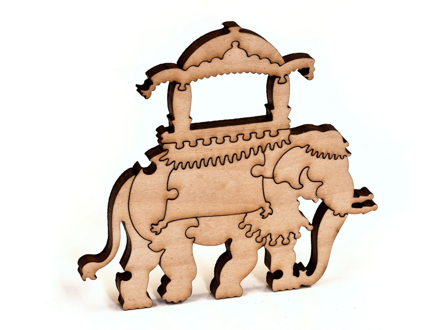 A closeup of pieces in the shape of an elephant with a saddle.
