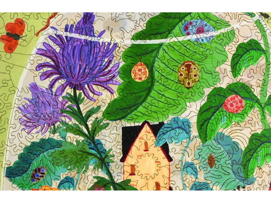 A closeup of the front of the puzzle, Bug Garden Terrarium, showing the detail in the pieces.