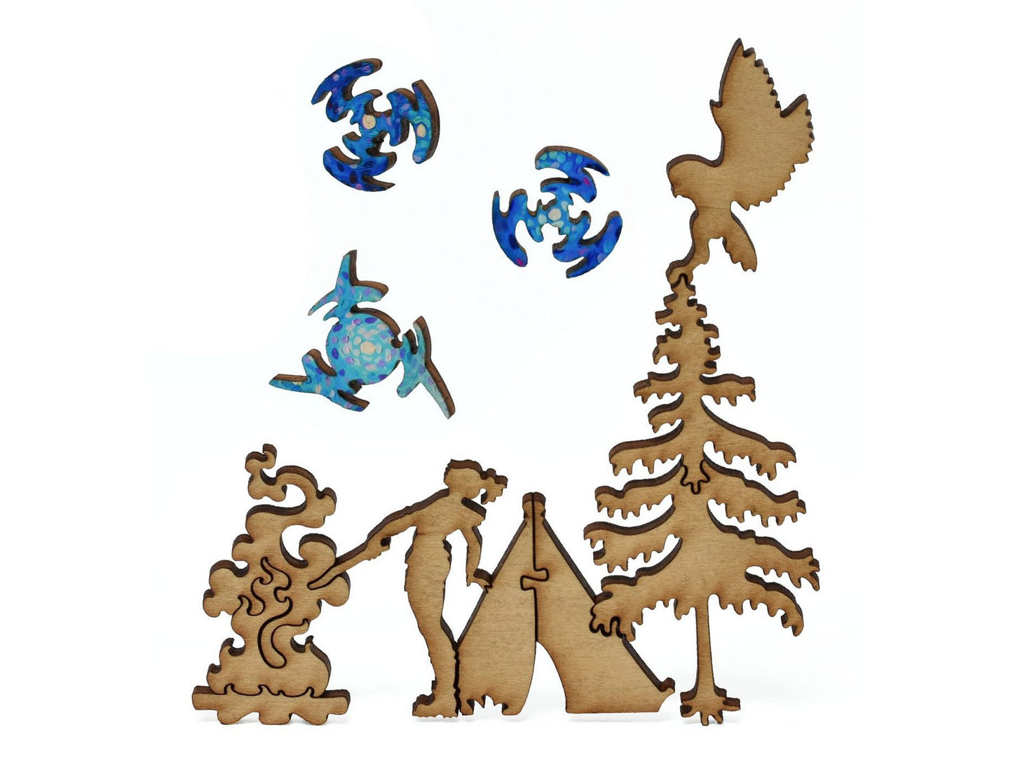 A closeup of pieces showing a camper with a campfire, tent, tree, and owl.
