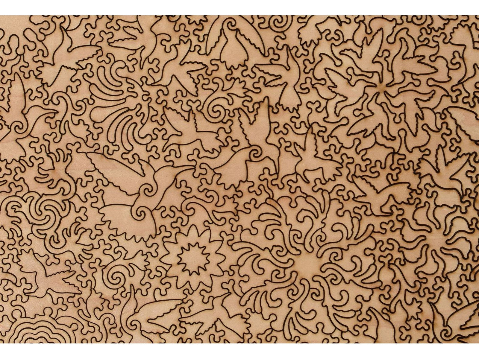 A closeup of the back of the puzzle, A Charm of Hummingbirds, showing the detail in the pieces.