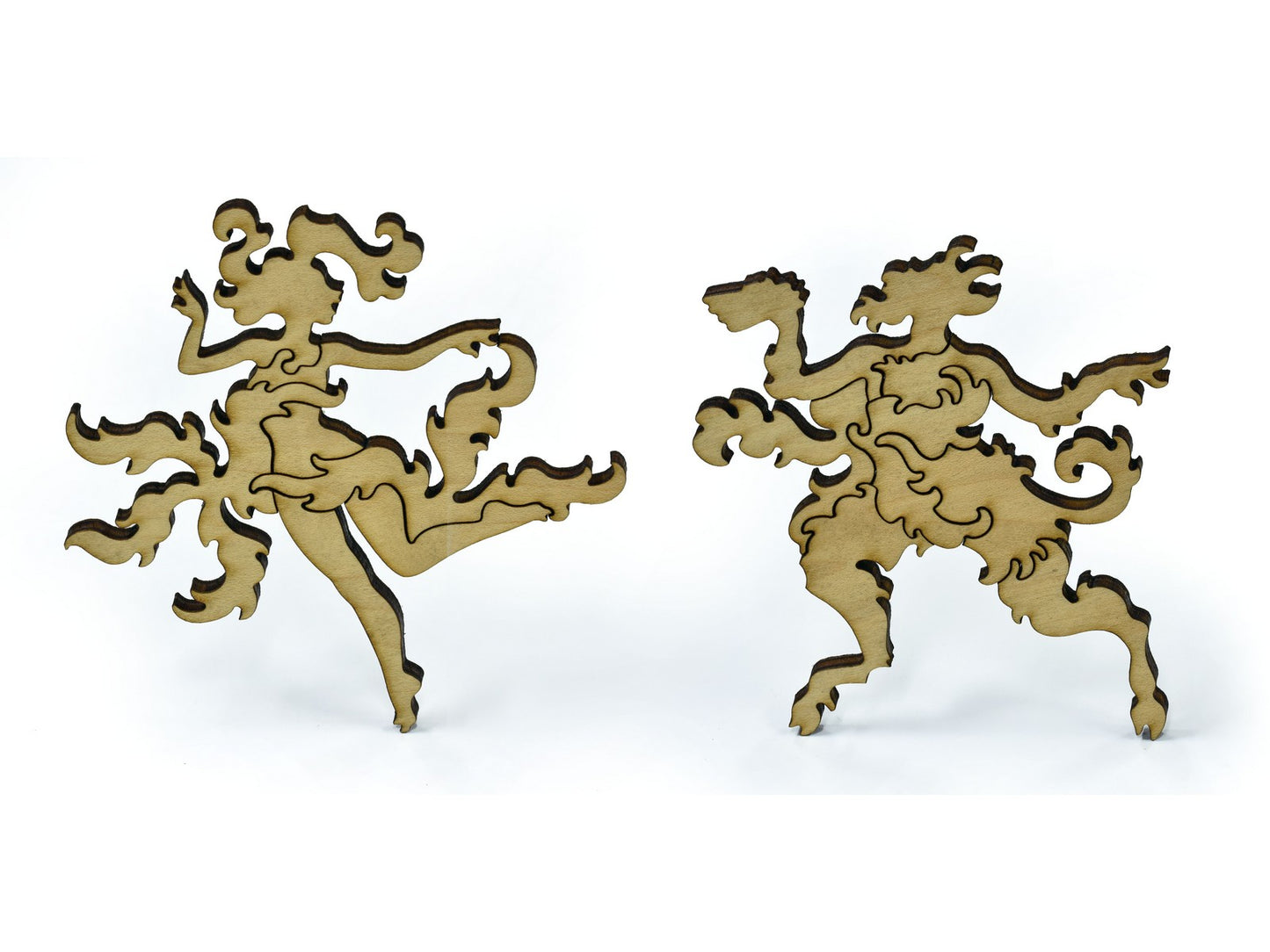 A closeup of pieces in the shape of a Forest Nymph and Satyr.