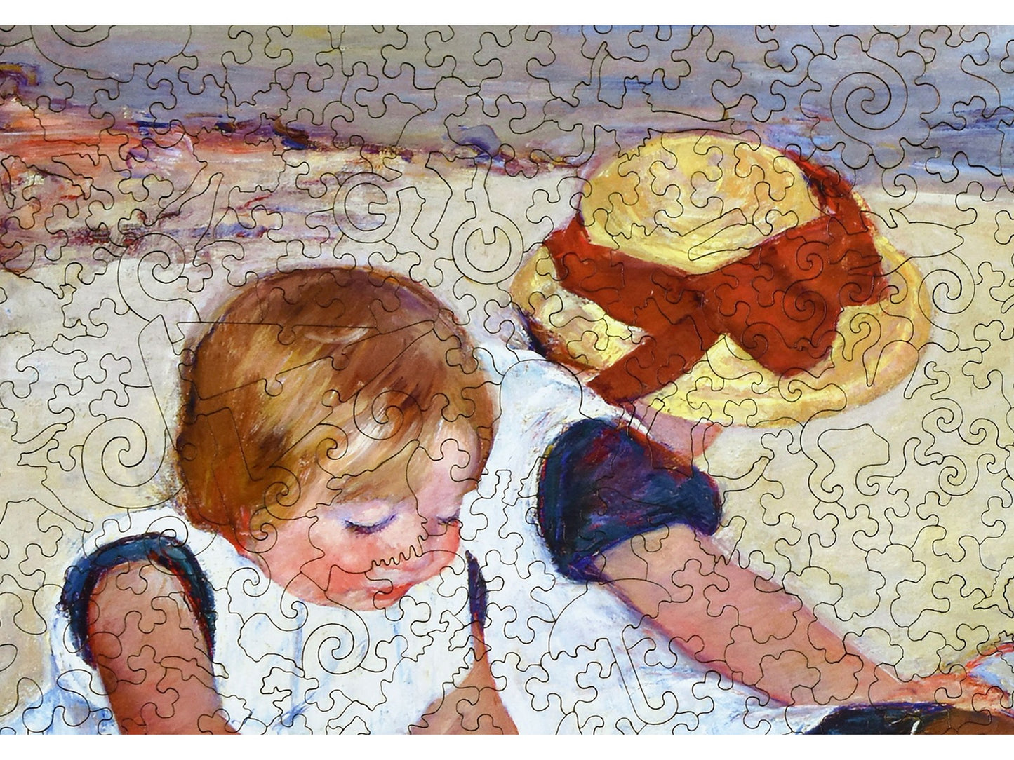 A closeup of the front of the puzzle, Children Playing on the Beach.