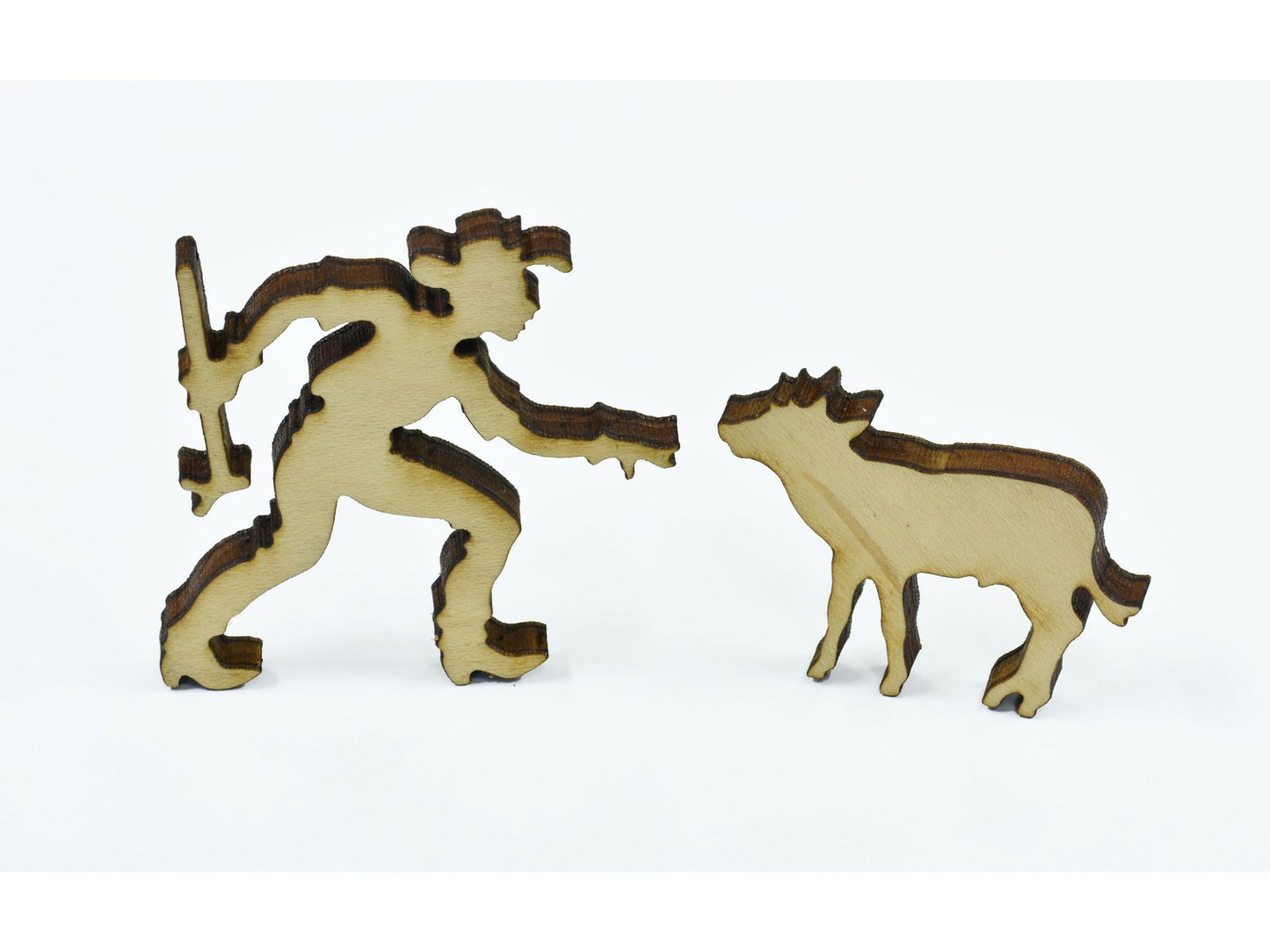A closeup of pieces in the shape of a person and a calf.
