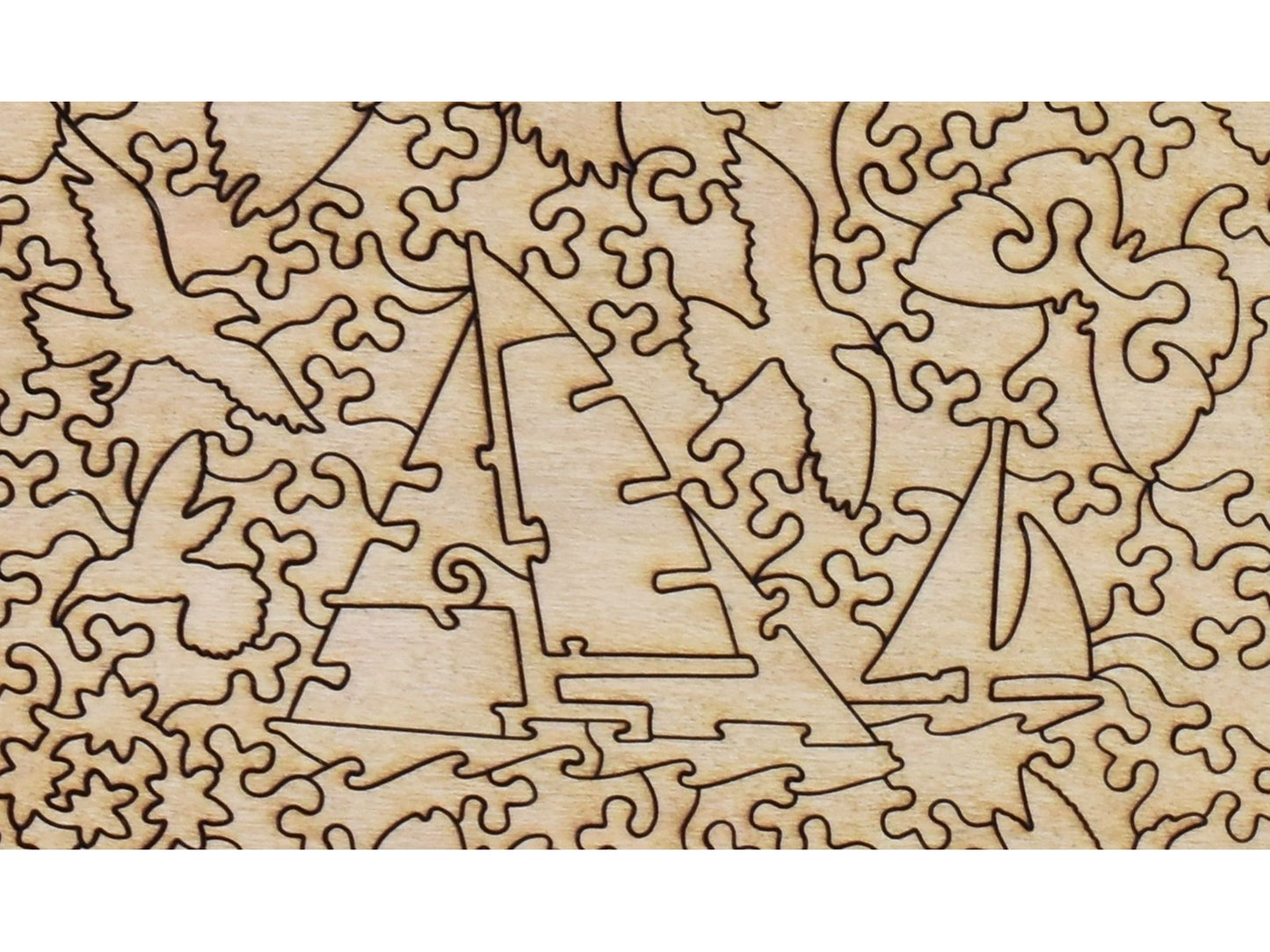 A closeup of the back of the puzzle, Coastal Landscape with Blooming Lilac Bush, showing the detail in the pieces.