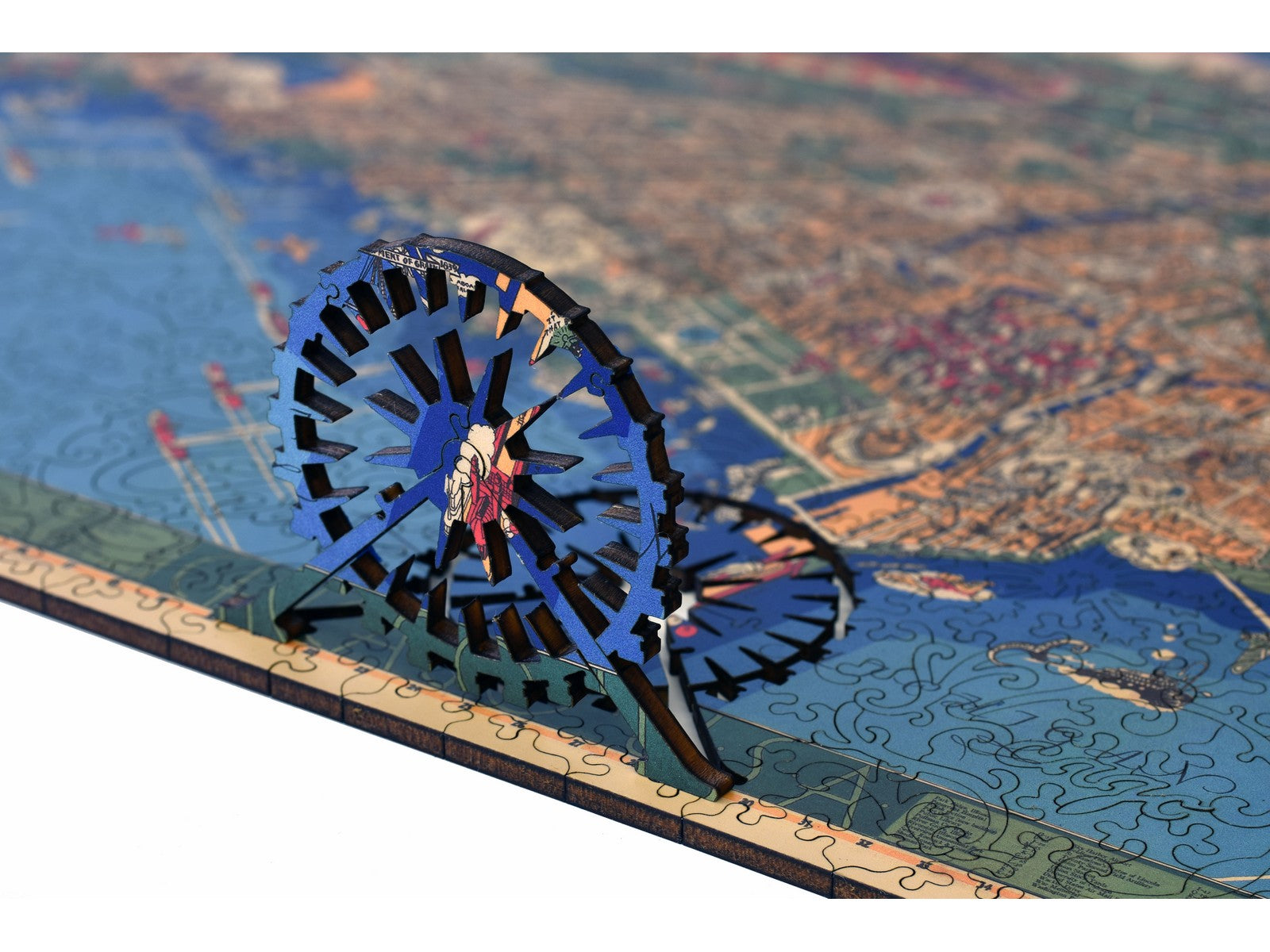 A closeup of the front of the puzzle with the ferris wheel pieces standing up.