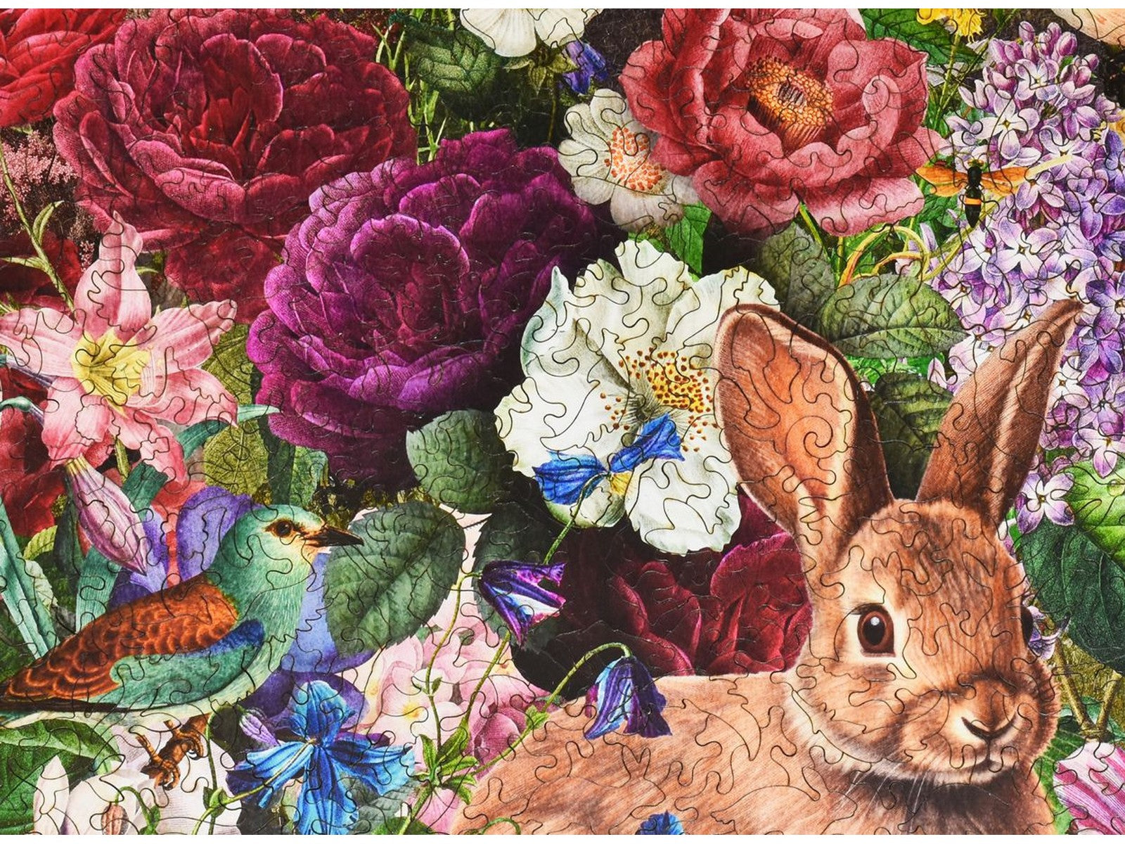 A closeup of the front of the puzzle, Floral Frolic, showing the detail in the pieces.