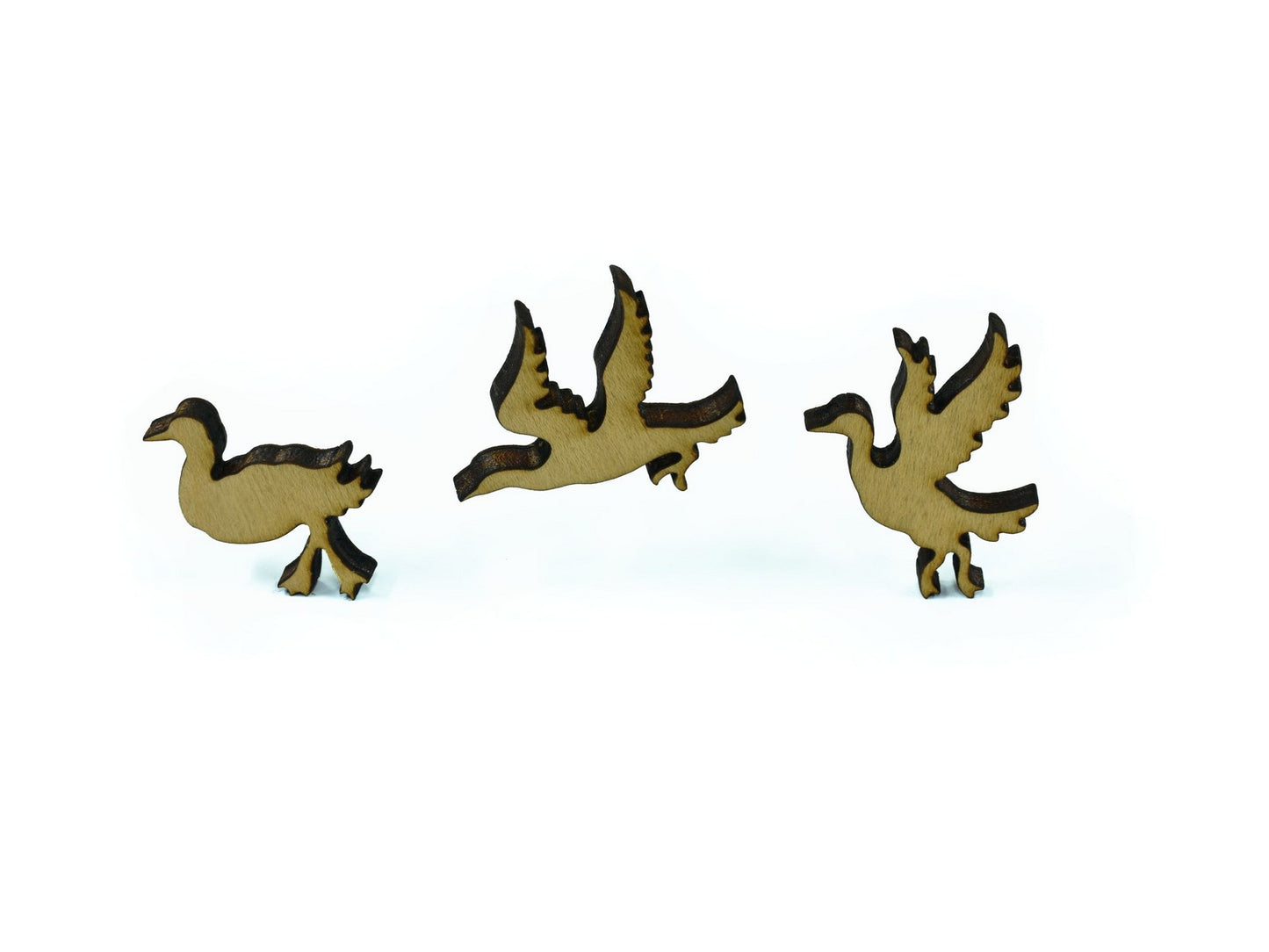A closeup of pieces in the shape of loons.
