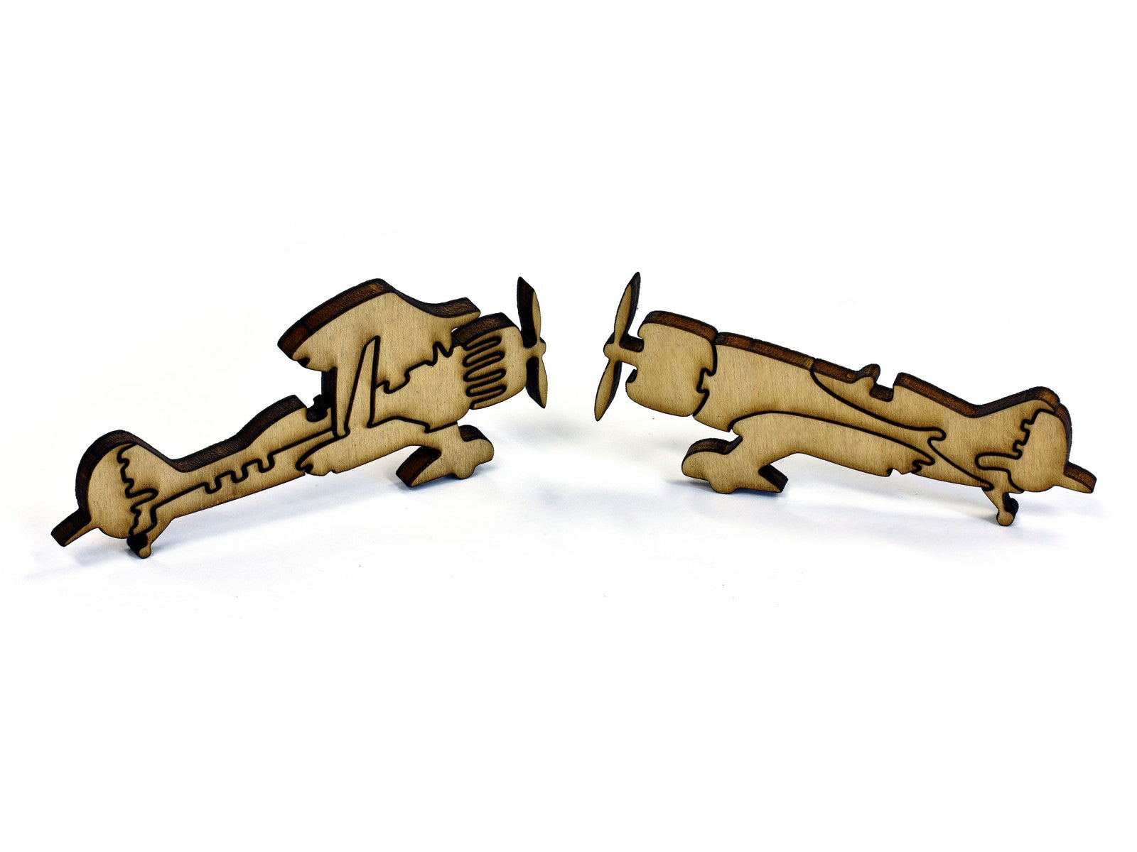 A closeup of pieces in the shape of airplanes.