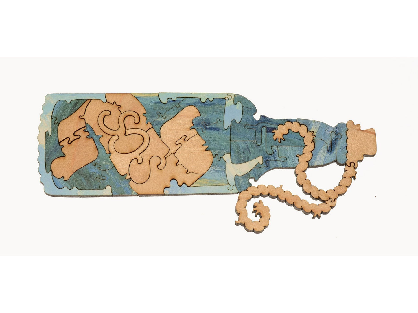 A closeup of pieces in the shape of a message in a bottle.
