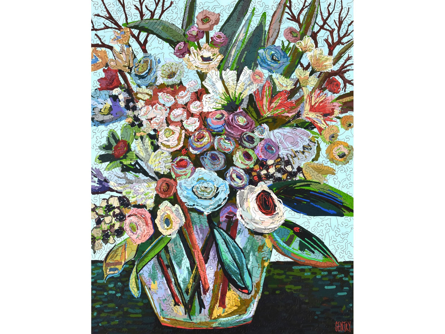 The front of the puzzle, Social Graces, with a vase of flowers.
