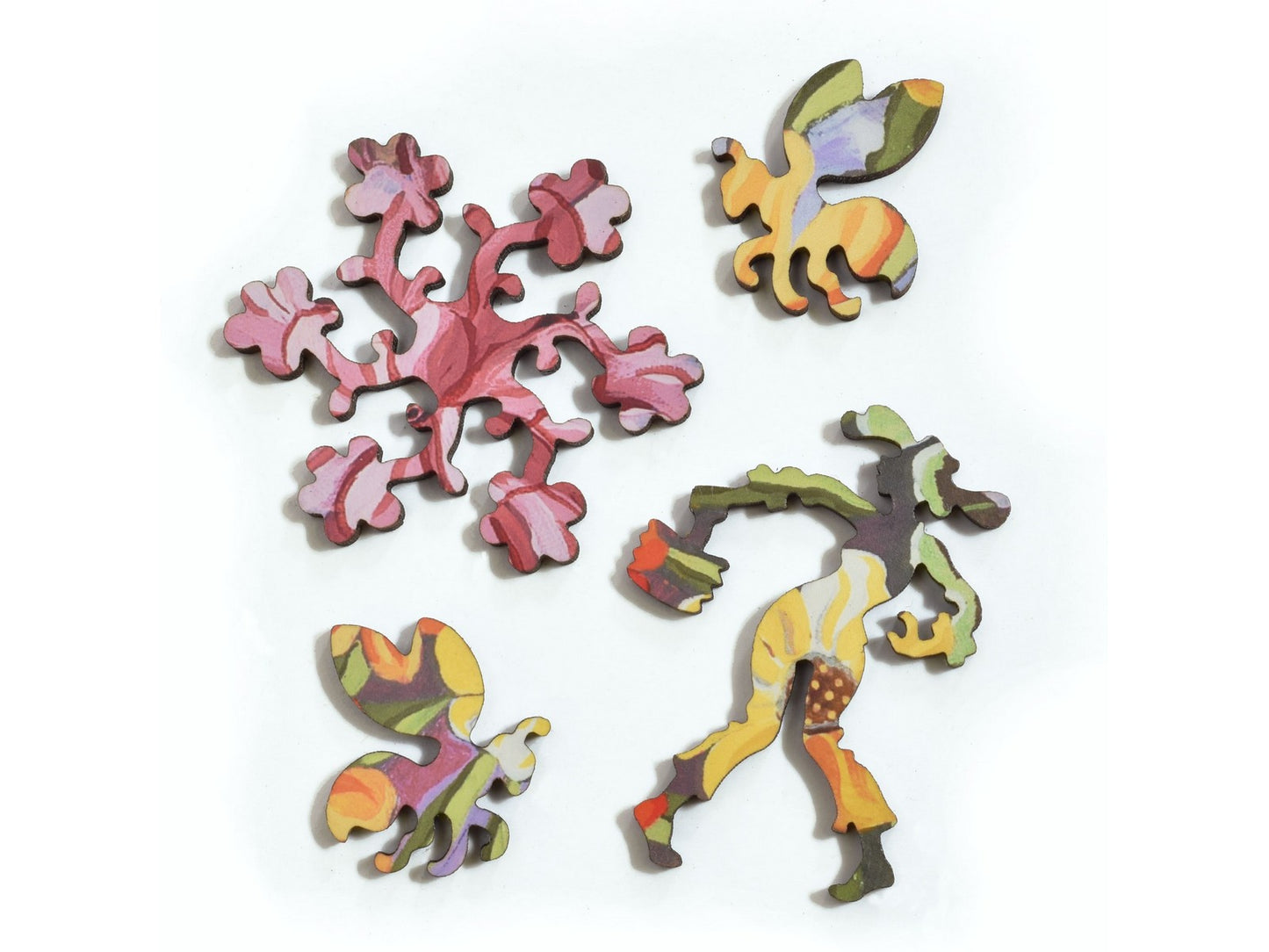 A closeup of pieces in the shape of flowers, bees, and a gardener.