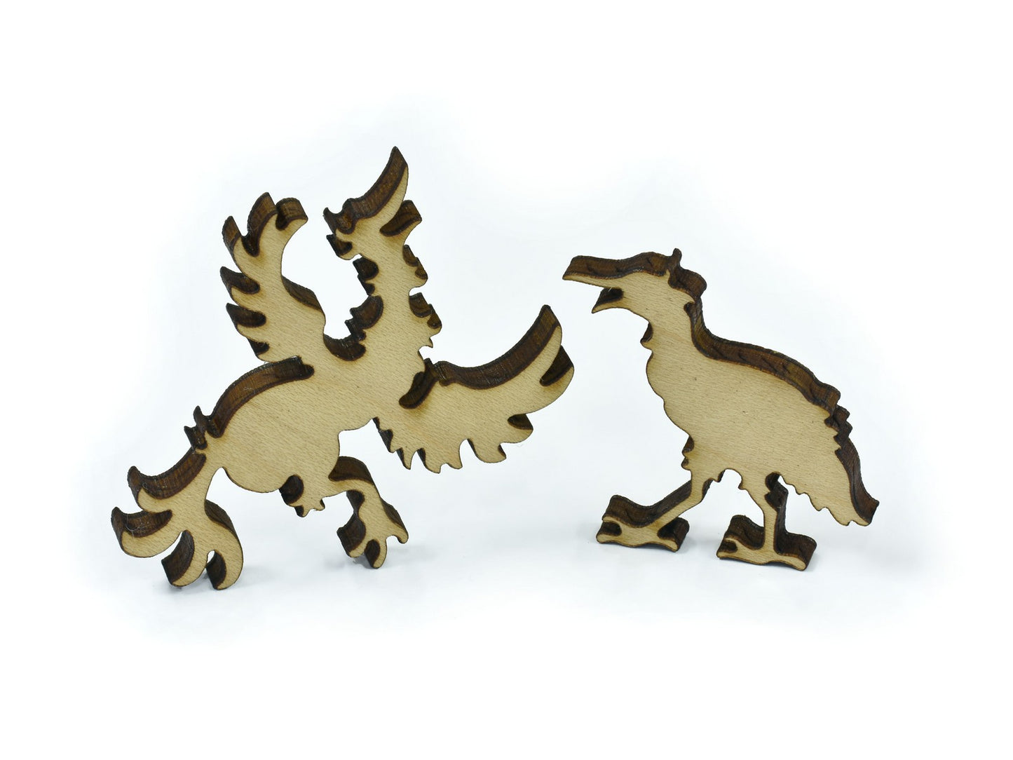 A closeup of pieces in the shape of birds.