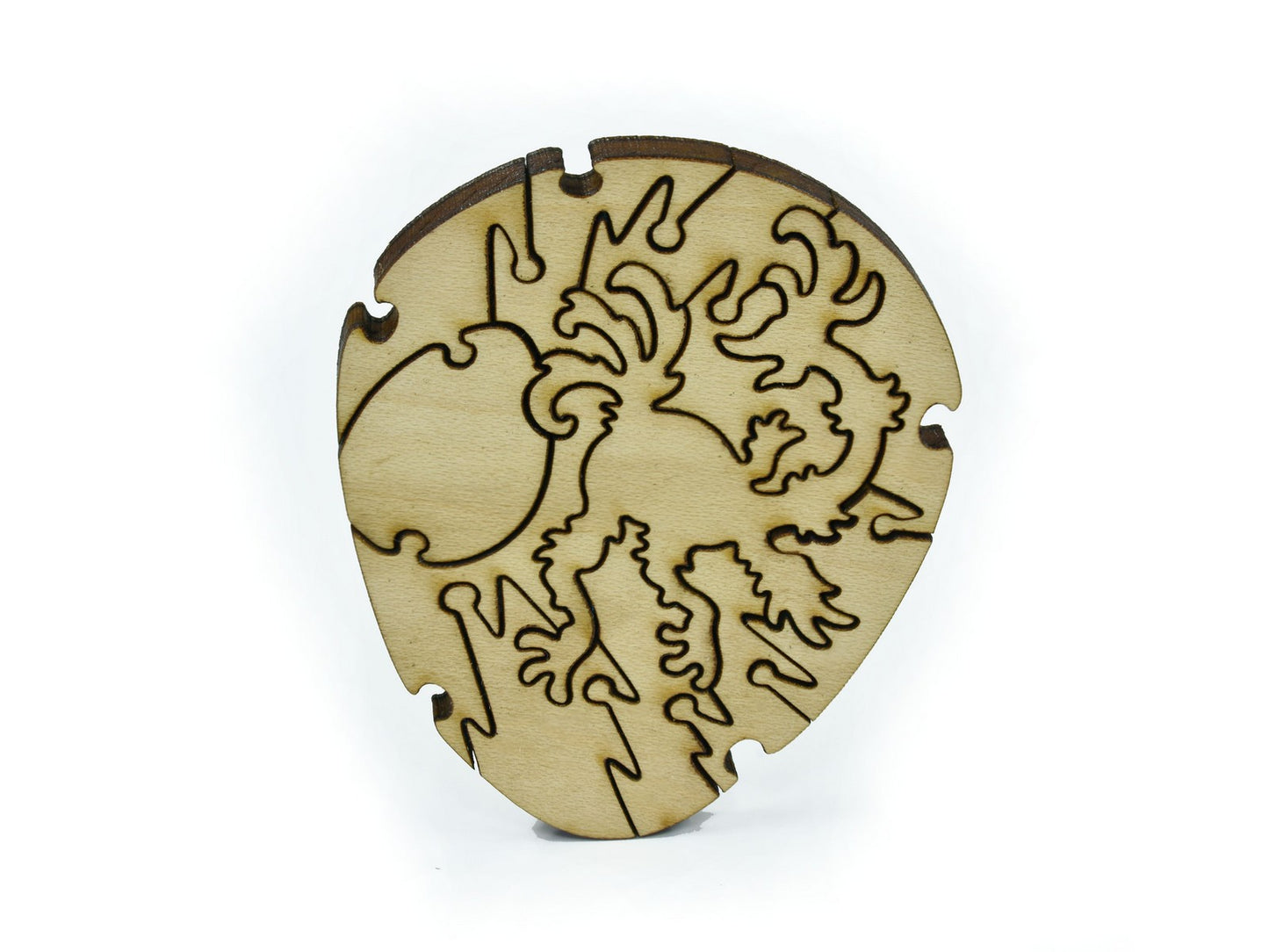 A closeup of pieces in the shape of a bird laying an egg.