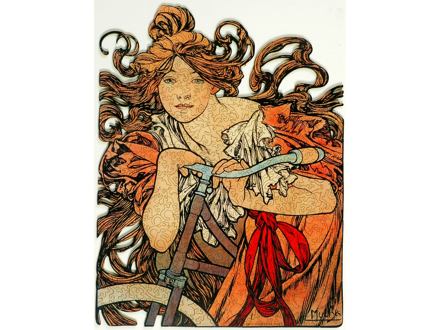 The front of the puzzle, Cycles Perfecta, which shows a woman with flowing hair on a bicycle.