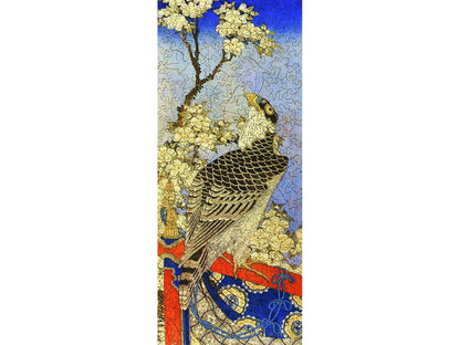 The front of the puzzle, Falcon and the Cherry Tree, which shows a bird in a flowering tree.