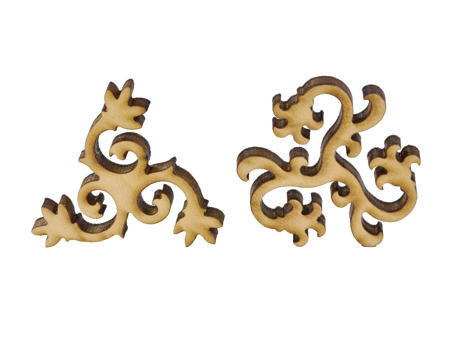 A closeup of pieces in the shape of floral vines.