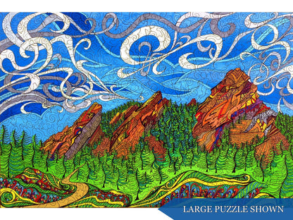 The front of the puzzle, Flatirons, which shows a trail leading into the mountains.