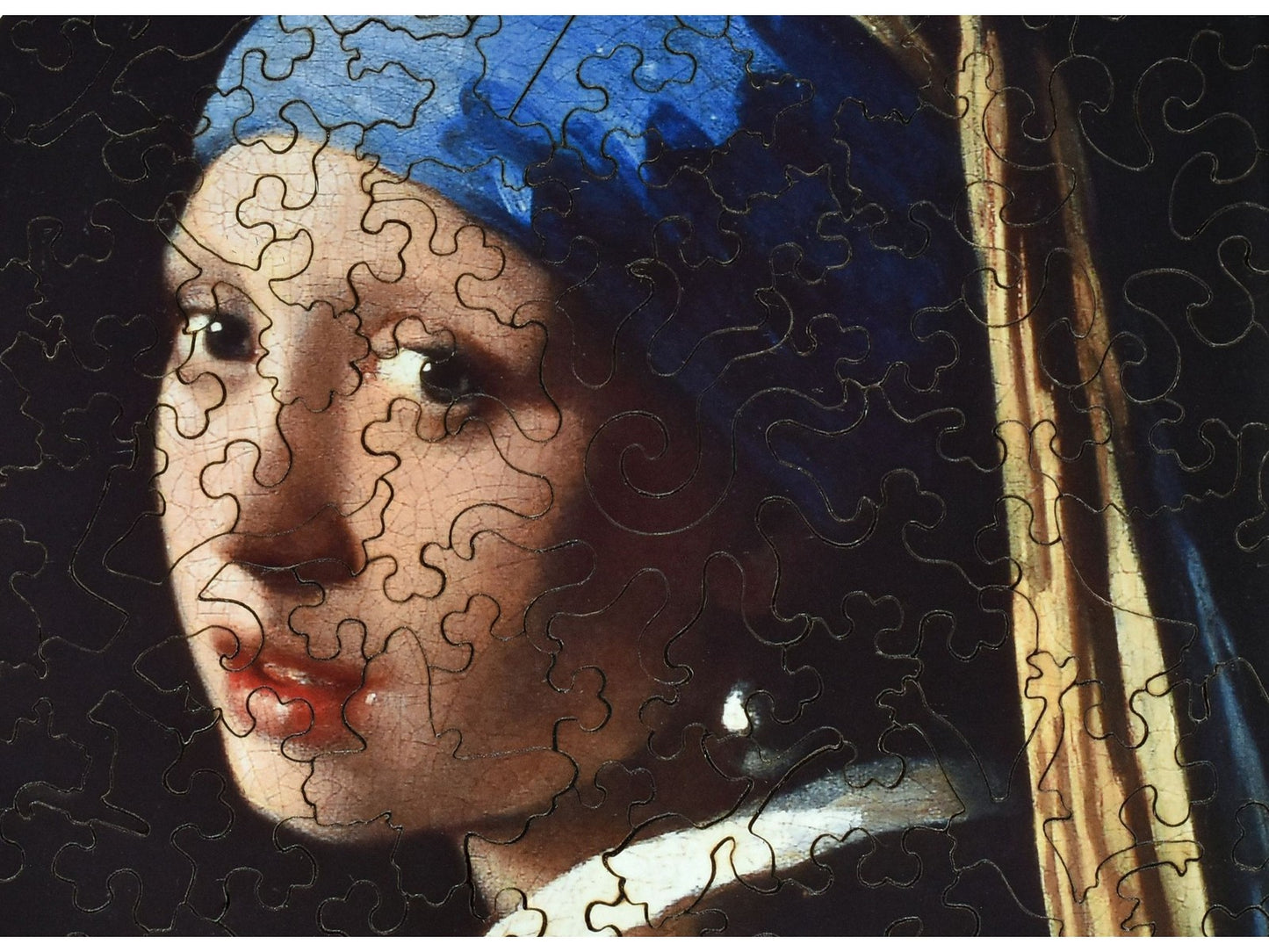 A closeup of the front of the puzzle, Girl with a Pearl Earring.