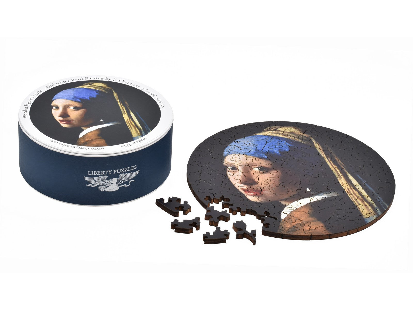 The puzzle, Girl with a Pearl Earring, shown with the box it comes in.