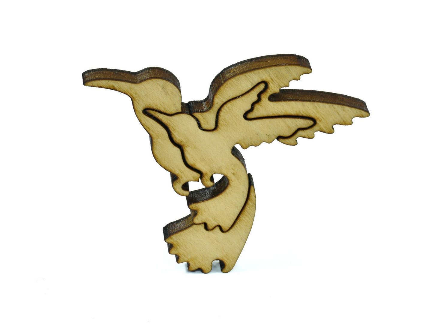 A closeup of pieces in the shape of hummingbirds.