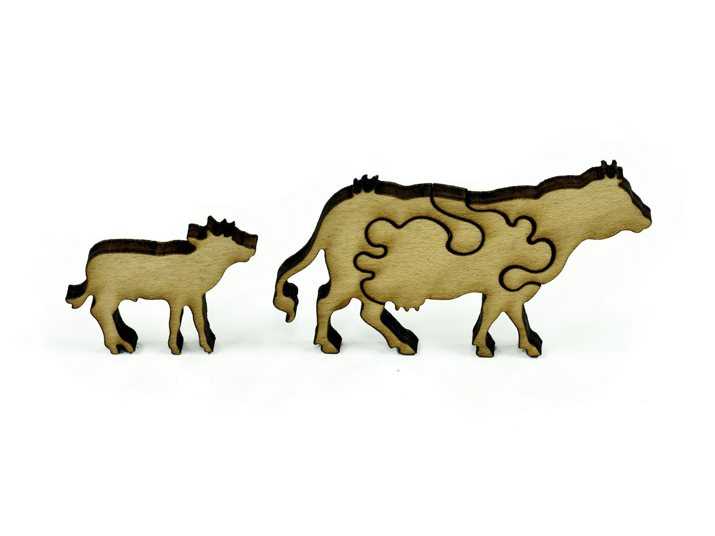 A closeup of pieces showing a cow and its calf.
