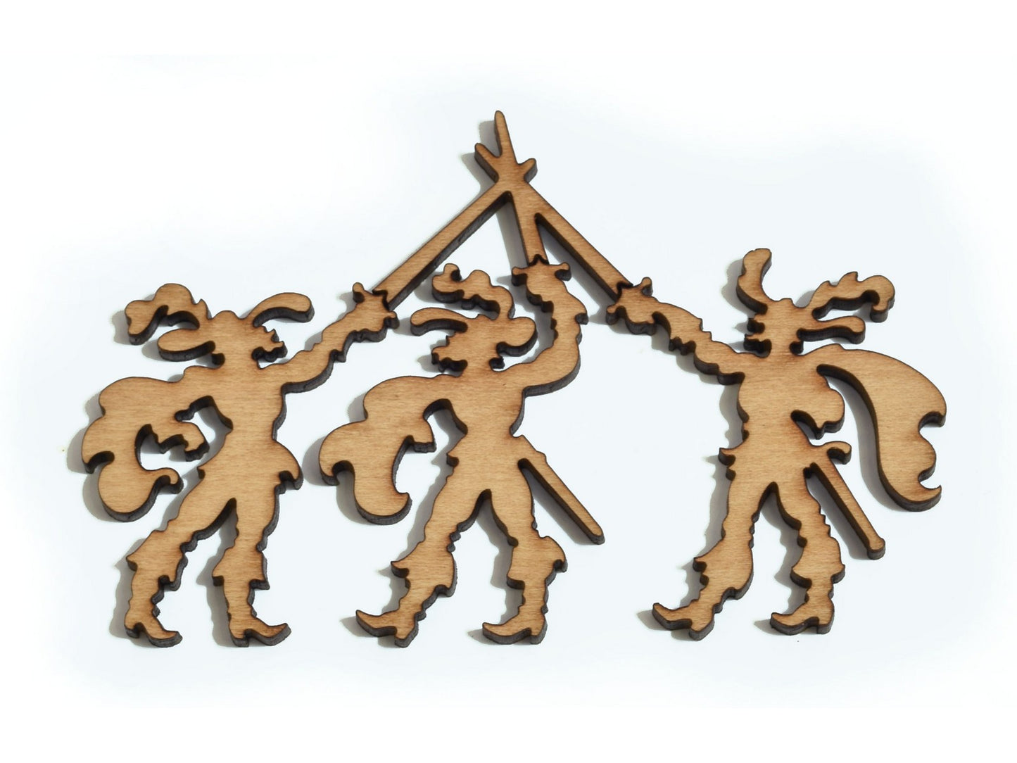 A closeup of pieces in the shape of the three musketeers.