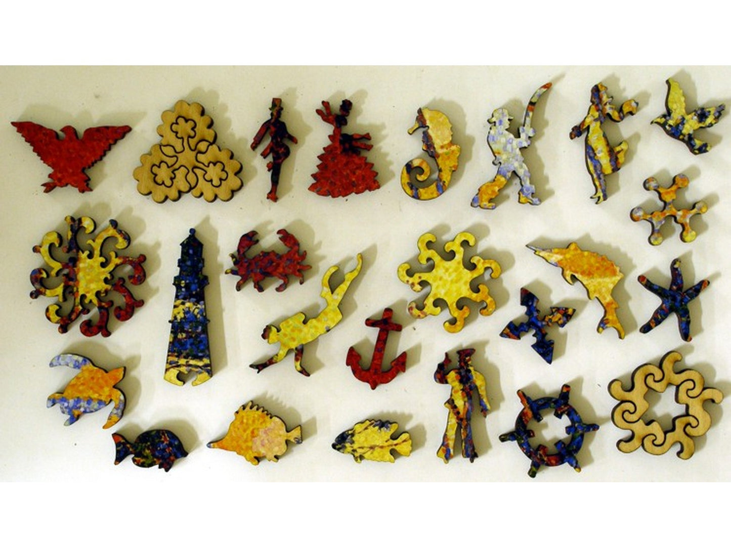 The whimsy pieces that can be found in the puzzle, Sails and Pine Trees.