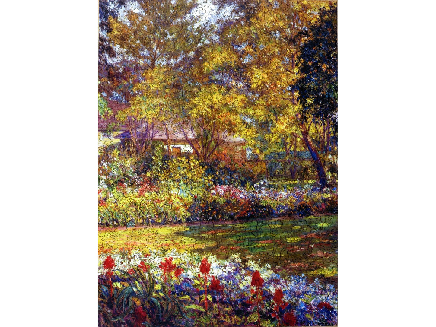 The front of the puzzle, September Garden, which shows a painting of a colorful garden with trees around it.