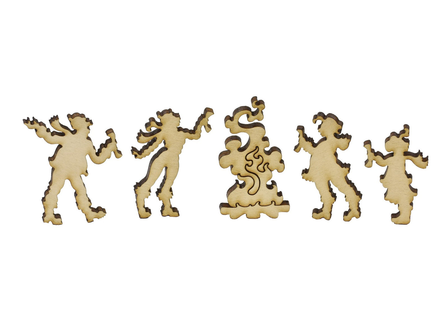 A closeup of pieces in the shape of people next to a campfire.