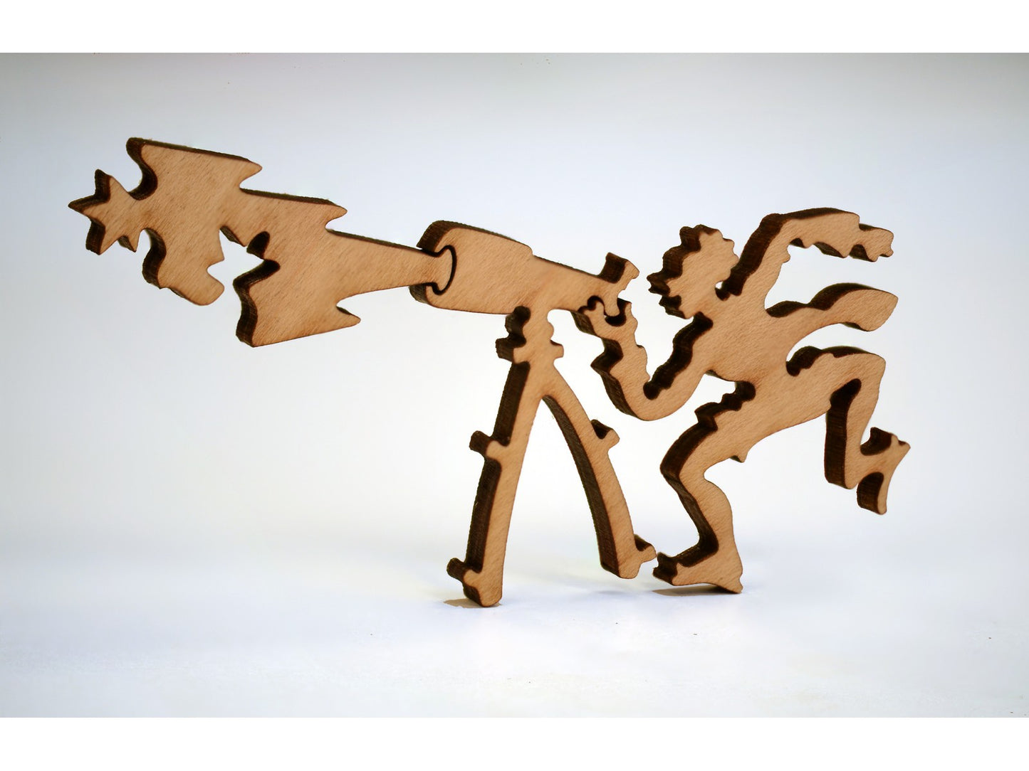 A closeup of pieces in the shape of a person looking through a telescope.